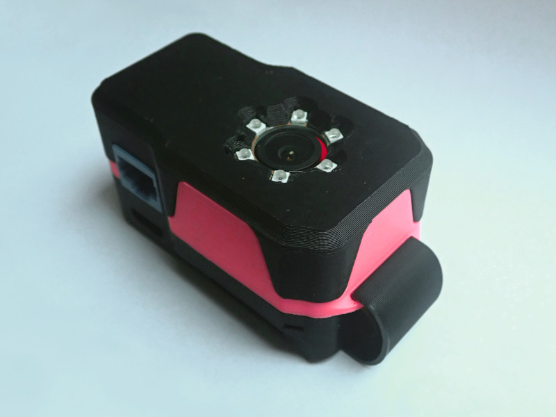 Tracking Camera in black and pink enclosure with IR LEDs around the camera lens
