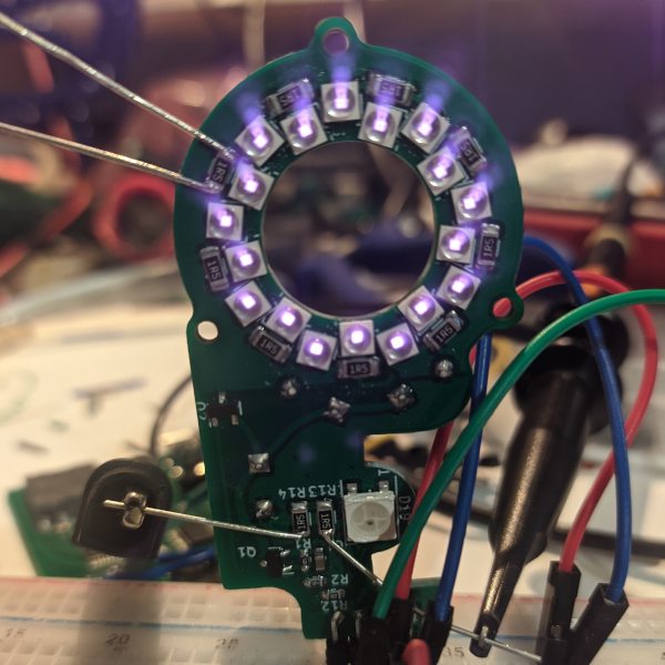 LED Board of the current Prototype with glowing IR Leds, hooked up to probes and jumper wires